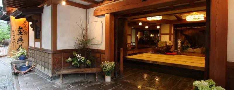Wooden entrance of Kanaguya ryokan in Shibu Onsen, the icon answer to where to stay near the snow monkey park